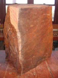 Huge Redwood Burl, nothing more than a block of wood, from which Harry Pollitt created his finished sculpture, Infinity Rising.  The wood block gives no hint of containing such gorgeous figure and grain.