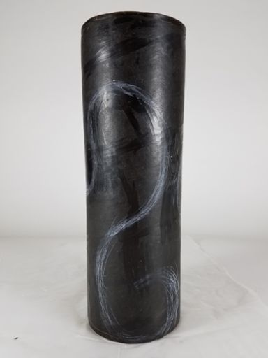 Dark brown wax cylinder with whispy white chalk design lines - the beginnings of a new Pollitt glass sculpture.