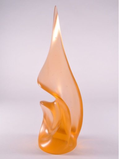 Designed as though wind billows its kiln-cast glass sails, this is an apricot-colored Pollitt Small Treasure sculpture.