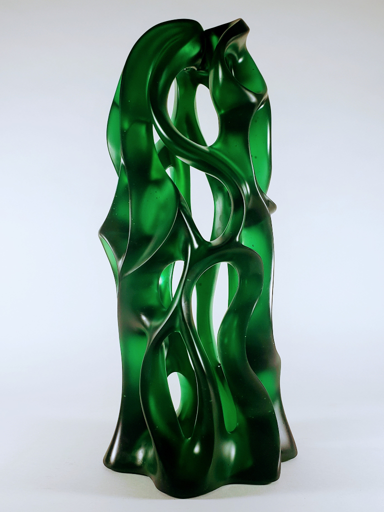 A different angle allows new views into and through this 2'-0" high, 10.5" diameter cast glass sculpture by Harry Pollitt.