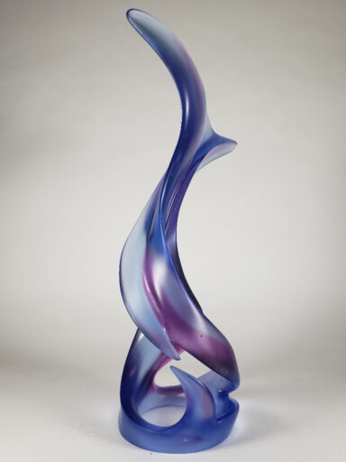 Grace and negative space uniquely unfold the pale cobalt blue and purple of Harry Pollitt's kiln cast glass sculpture named Feminique.